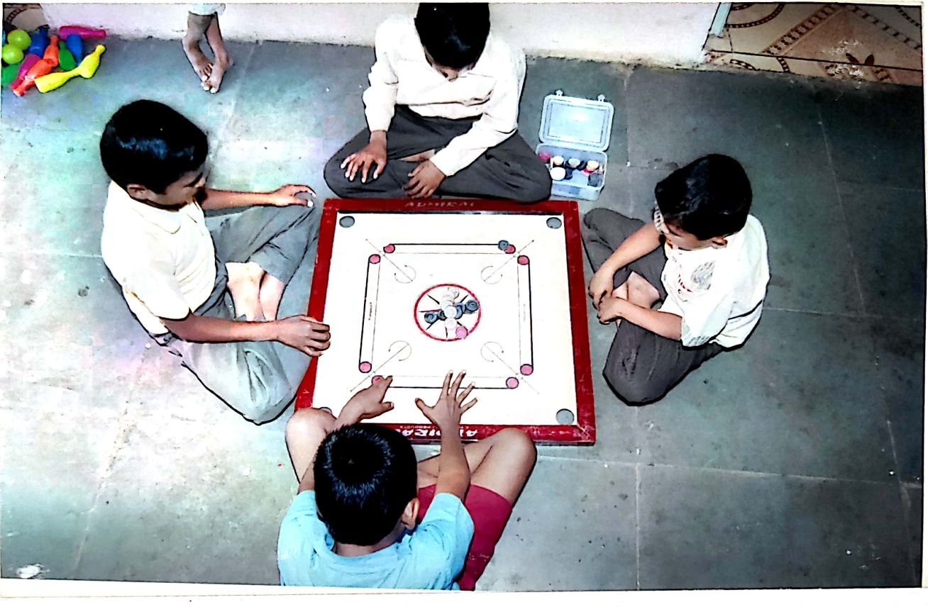 Students playing carrom