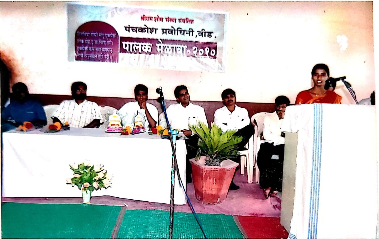 *Director Asha Gore interacting with parents at the parents' gathering*